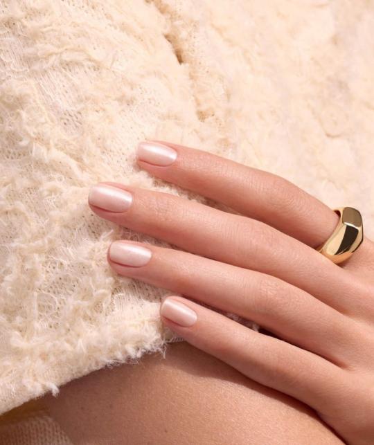 Manicure with Pearlescent GREEN™ Manucurist nail polish, pearlescent beige with pink undertones