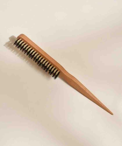 BACHCA Paris Slick Back Hairbrush with beech wood handle and natural boar bristles on a neutral beige background
