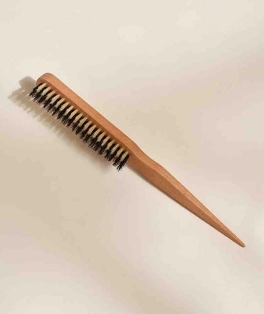 BACHCA Paris Slick Back Hairbrush with beech wood handle and natural boar bristles on a neutral beige background