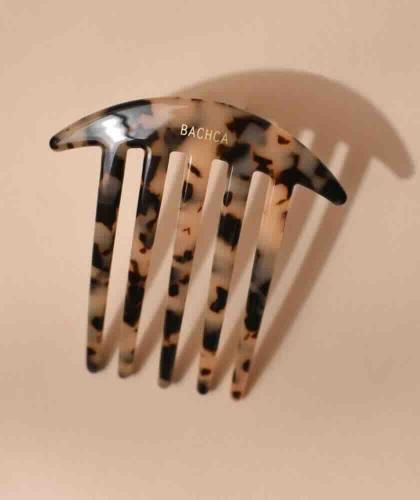 BACHCA Paris Tortoiseshell Hair Bun Comb in cellulose acetate on a warm beige background