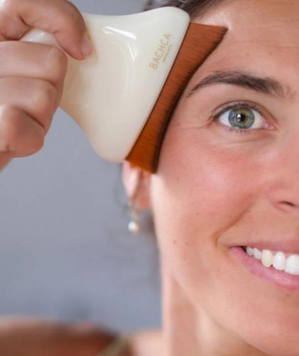 BACHCA Paris Lymphatic Drainage Face Brush used for facial massage at the temples
