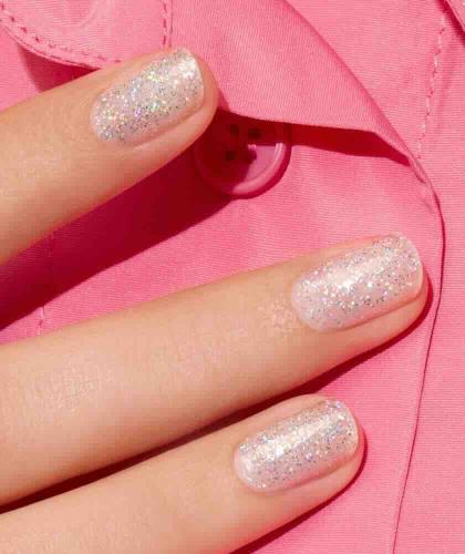 Mermaid Manucurist Green nail polish, sheer holographic glitter polish on close-up nails